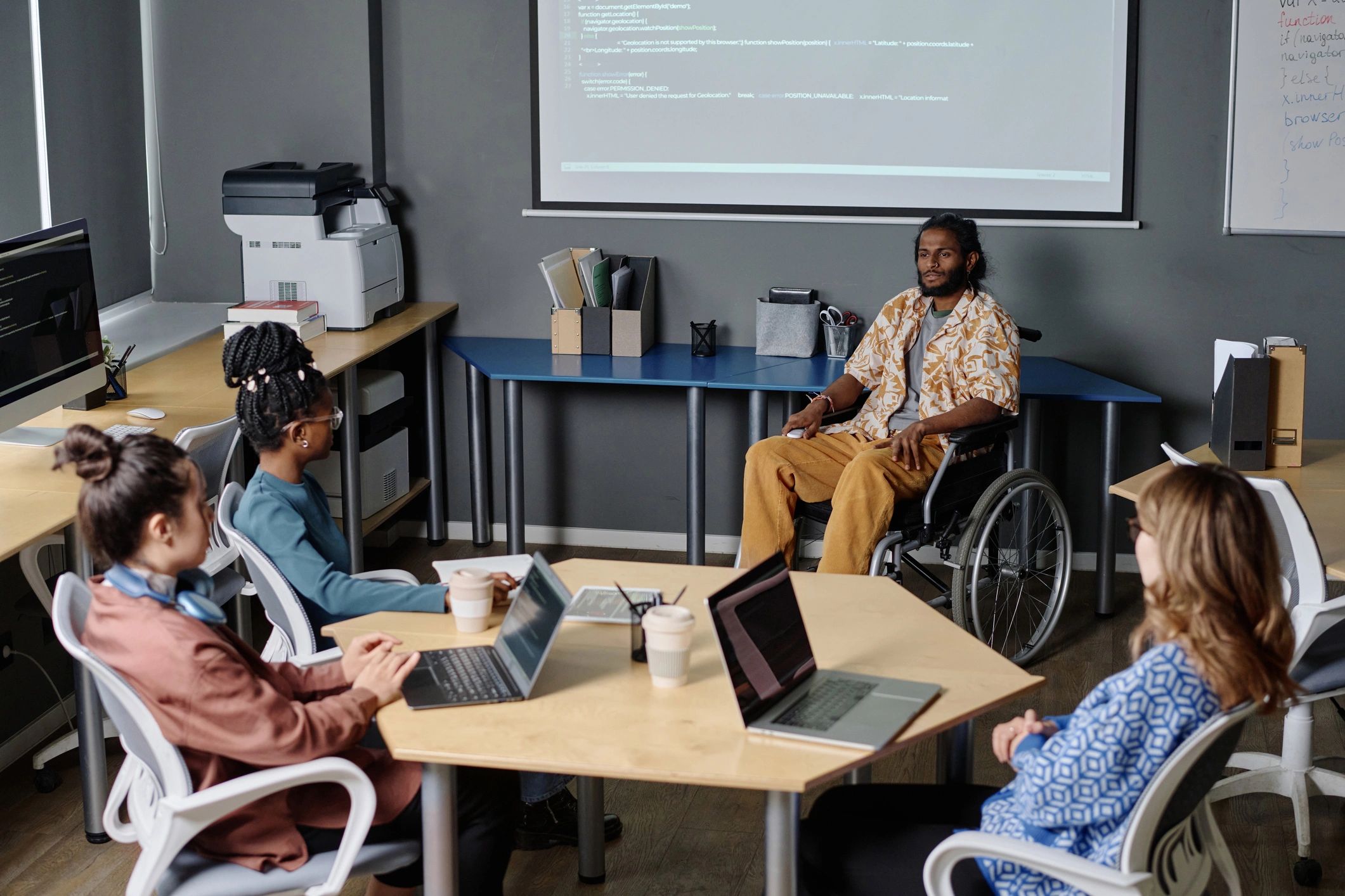 Professional team presentation led by an employee who uses a wheelchair