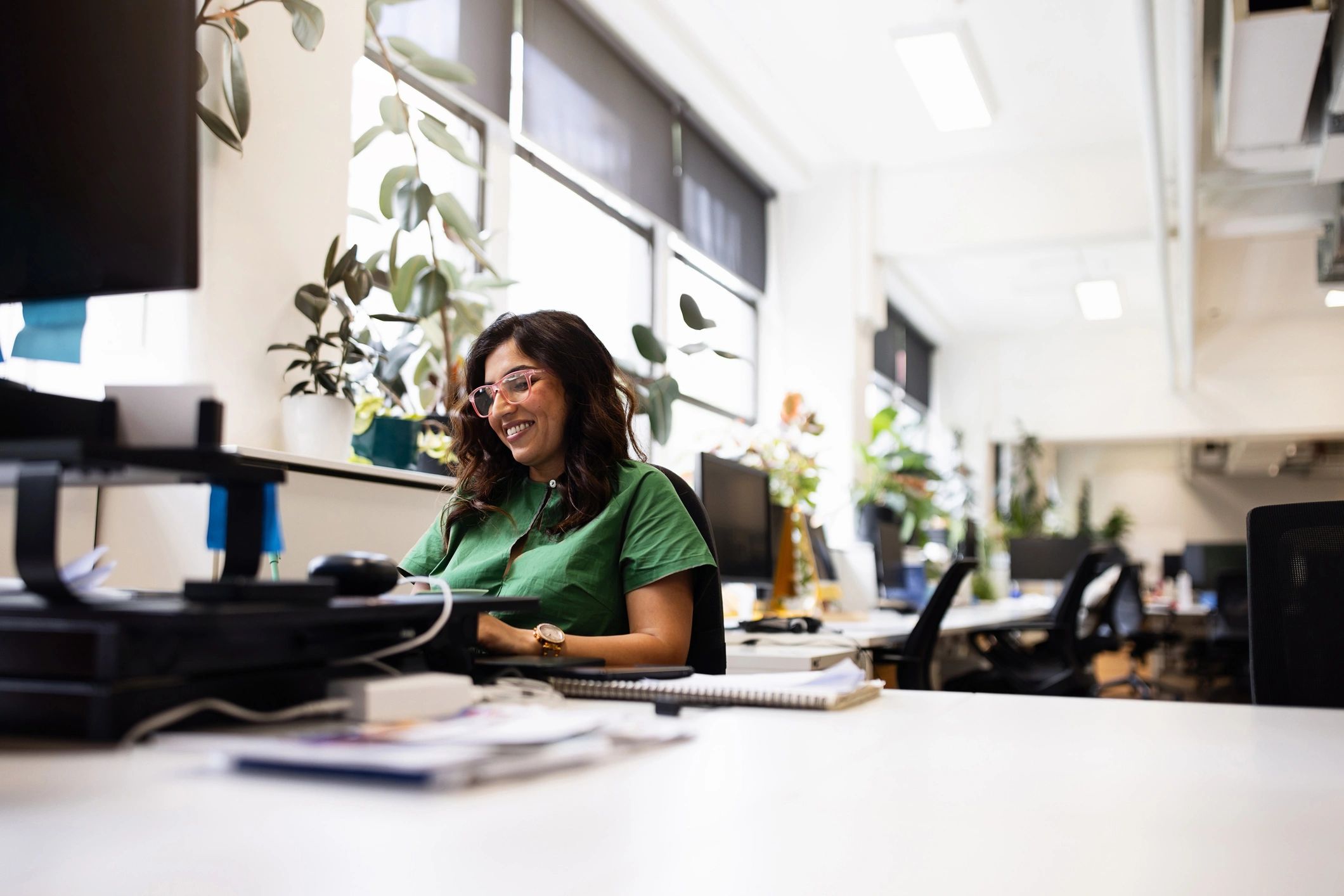 Young professional smiling in a modern office
